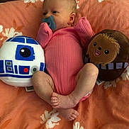 Ellie joined the competition — help win amazing prizes! baby, chewbacca, child, comfortable, curious, cute, floral_pattern, indoors, infant, lying_down, newborn, orange_blanket, pacifier, pink_onesie, plush_toy, r2d2, resting, small_feet, soft_toys, star_wars