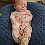 Ellie is registered to the contest to win money with this photo: baby, blanket, blue_cushion, child, cozy, cute, face, footie_pajamas, indoor, infant, monkey_prints, newborn, pajamas, peaceful, pink, plush_toy, relaxed, resting, sleeping, soft_texture