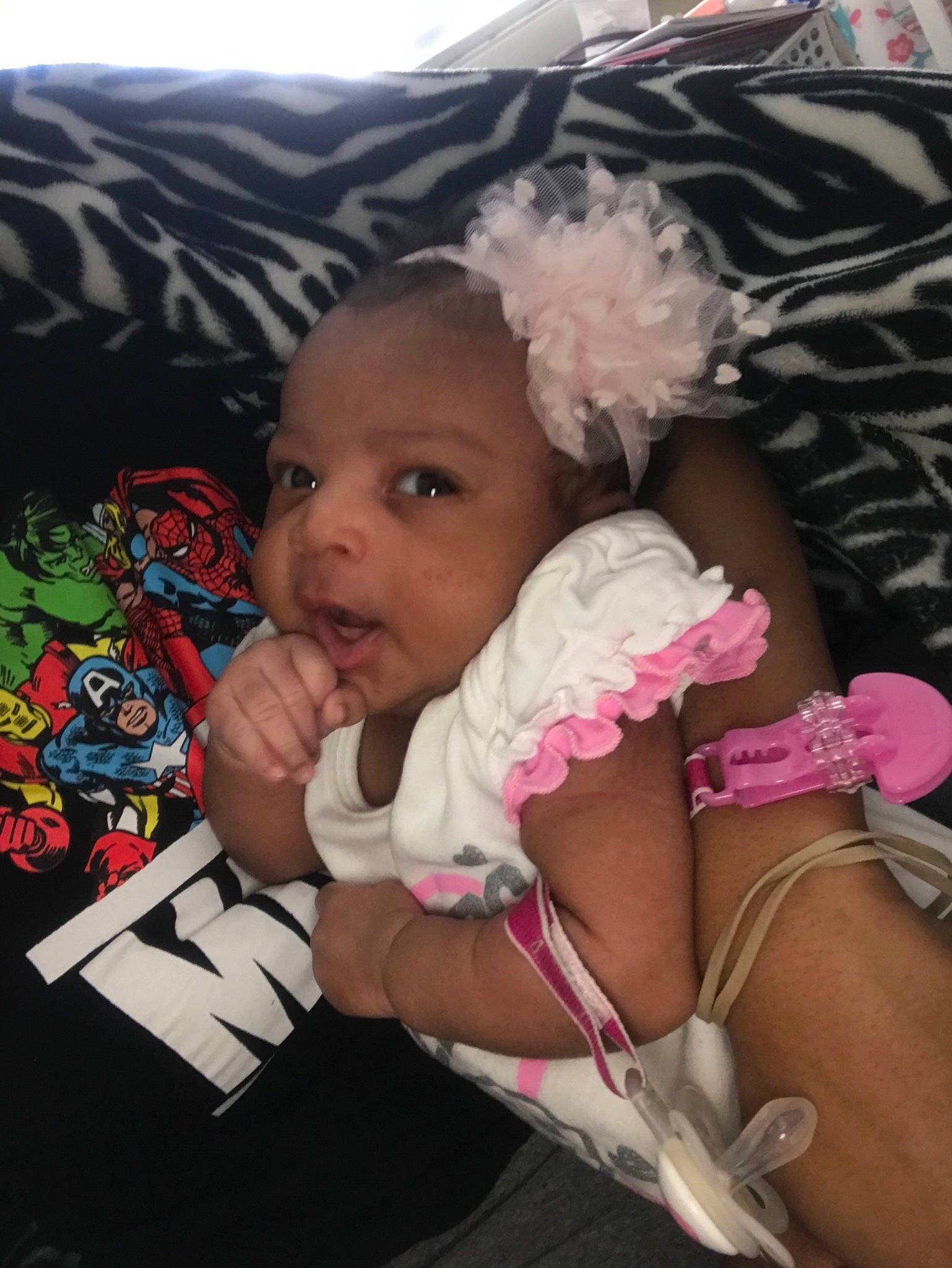 Taliyah is registered to the contest to win money with this photo: arm, baby, cheek, child, electronic_device, headwear, leg, person, pink, toddler