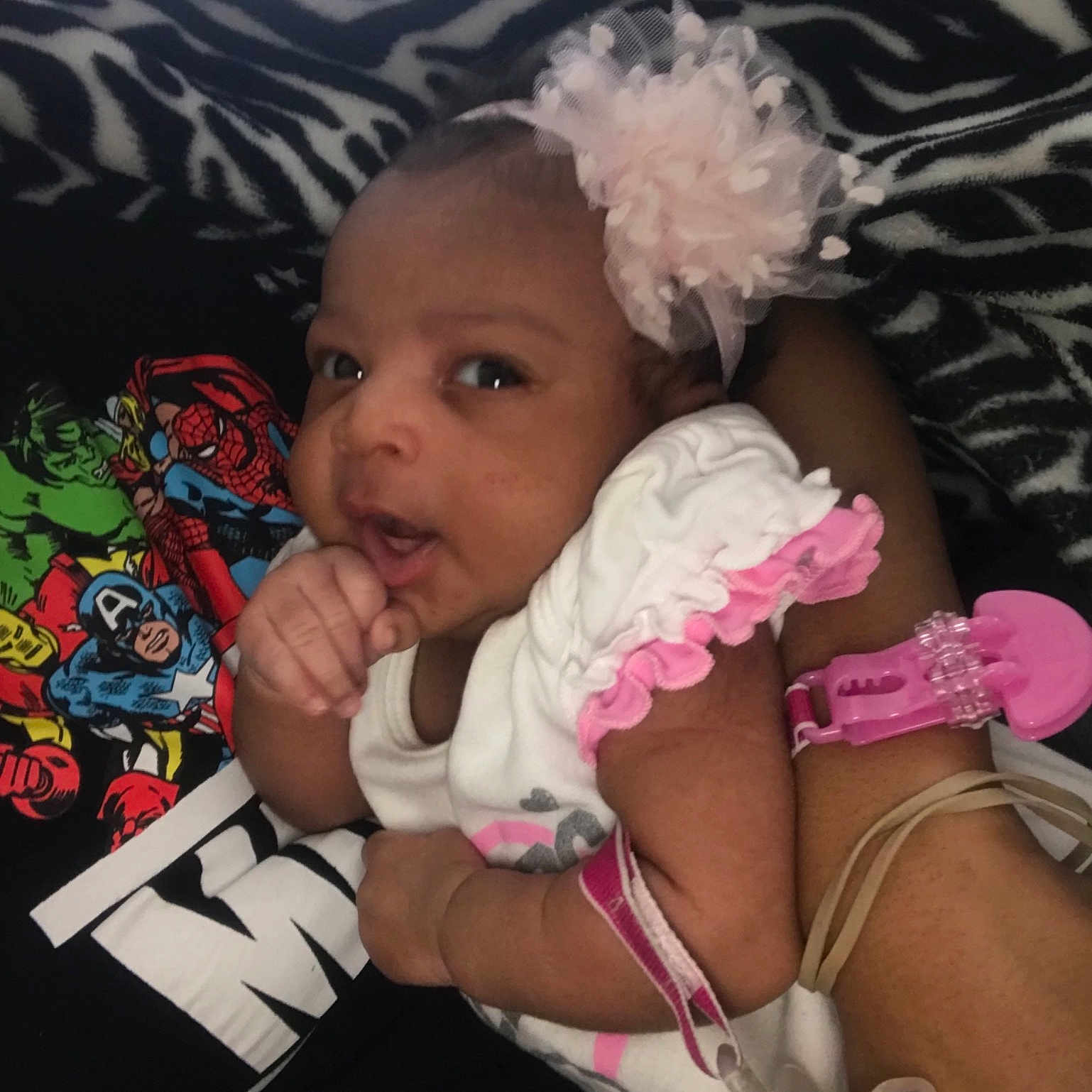 Taliyah is registered to the contest to win money with this photo: arm, baby, cheek, child, electronic_device, headwear, leg, person, pink, toddler