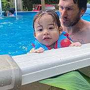 Noah joined the competition — help win amazing prizes! adult, backyard, child, daytime, family, fun, hammock, life_jacket, outdoor, person, play, red_vehicle, relaxation, safety, summer, swimming_pool, toddler, trees, water, wet_hair