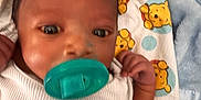 Elijah joined the competition — help win amazing prizes! baby, pacifier, blanket, winnie_the_pooh, infant, child, clothing, cute, dinosaur, lying_down, face, hand, blue, white, pattern, smile, soft_texture, bed, young, toddler
