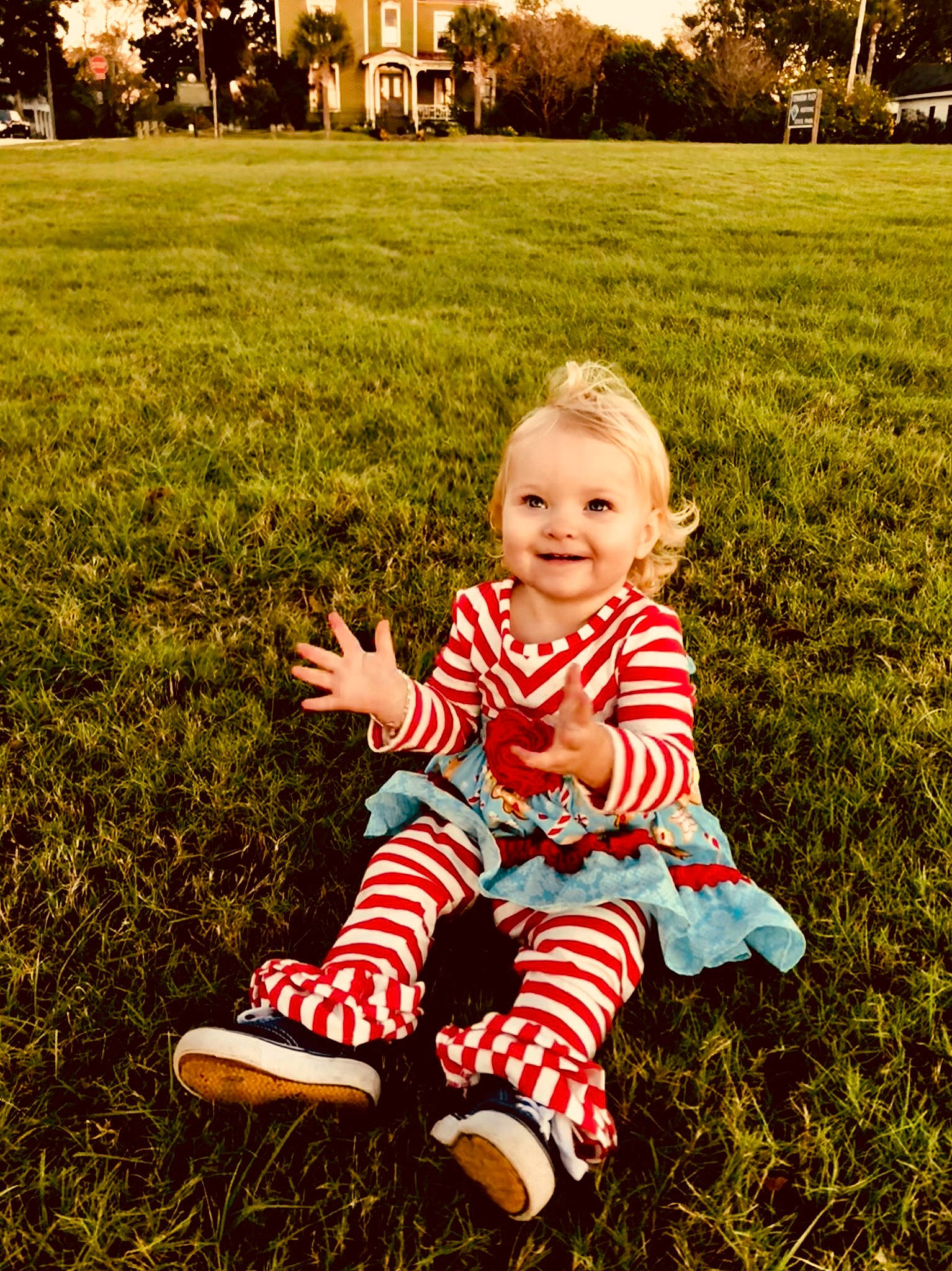 Laylah is registered to the contest to win money with this photo: child, emotion, fun, garden, girl, grass, happiness, infant, joy, lawn, leaf, person, photograph, plant, play, recreation, sitting, smile, spring, toddler