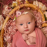 Willow joined the competition — help win amazing prizes! baby, infant, wrapped, blanket, basket, flowers, headband, pink, curly_wool, portrait, closeup, cute, newborn, soft_lighting, peaceful, hands, face, skin, decor, cozy