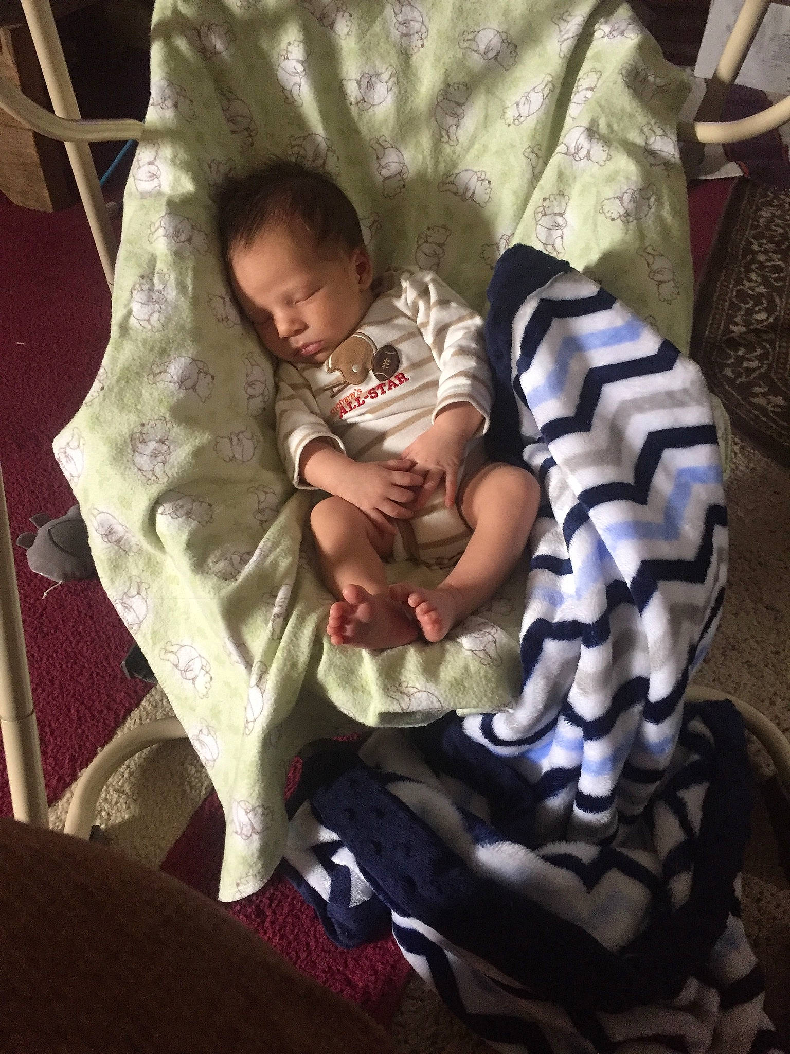 Silas joined the competition — help win amazing prizes! baby, baby_products, baby_toddler_clothing, bedding, bedtime, carmine, chair, child, comfort, foot, human_leg, infant_bed, lap, leg, linens, nap, pattern, person, room, sitting