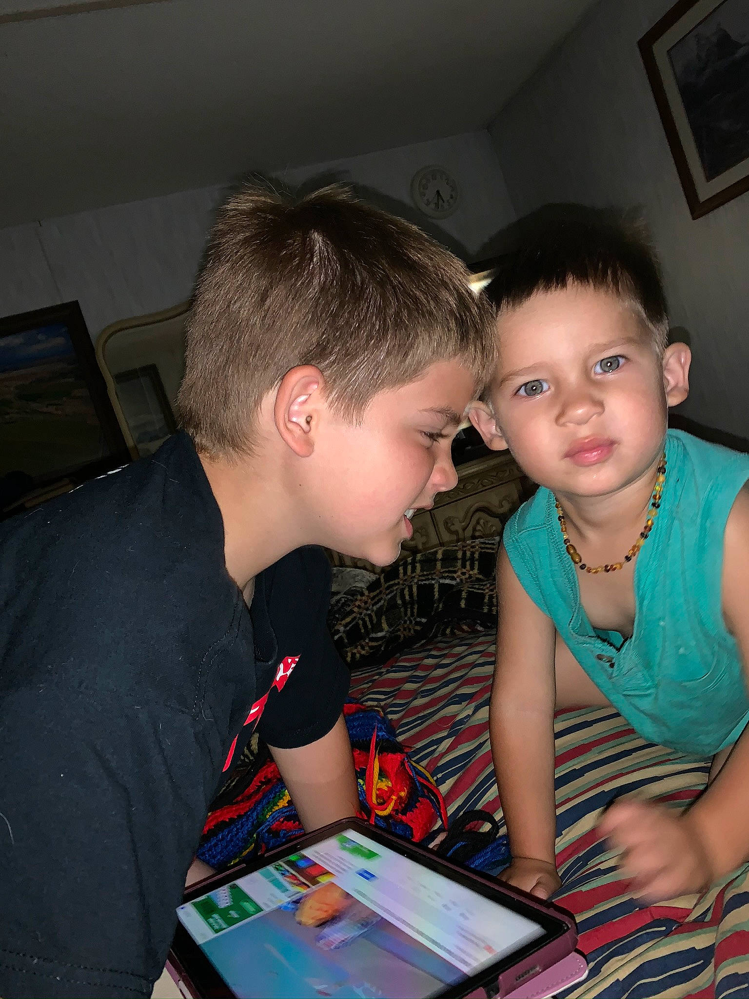 Silas is registered to the contest to win money with this photo: child, couch, event, fun, gadget, happy, jewellery, leisure, necklace, party, person, picture_frame, play, reading, recreation, room, sharing, sitting, t_shirt, tablet_computer