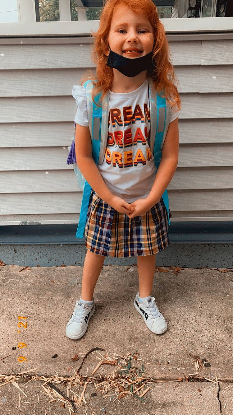 Allie joined the competition — help win amazing prizes! cool, electric_blue, eyewear, fashion_design, footwear, hair, happy, joy, knee, long_hair, orange, person, plaid, sleeve, smile, sportswear, street_fashion, t_shirt, tartan, thigh