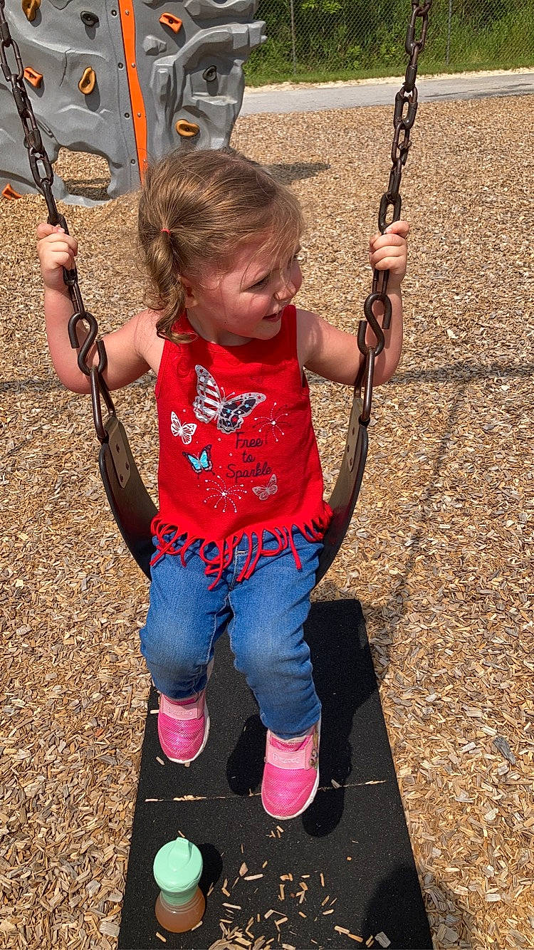 Izabella joined the competition — help win amazing prizes! blue, child, city, electric_blue, fun, green, happy, leisure, light, outdoor_play_equipment, people, people_in_nature, person, photograph, playground, playing_sports, public_space, recreation, swing, toddler