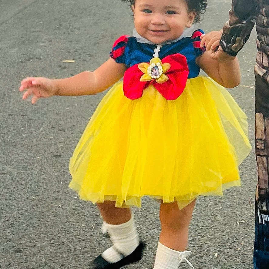 Harmoni joined the competition — help win amazing prizes! child, city, clothing, costume, dress, face, female, footwear, girl, head, pants, person, photography, portrait, road, shoe, skirt, street, urban, walking