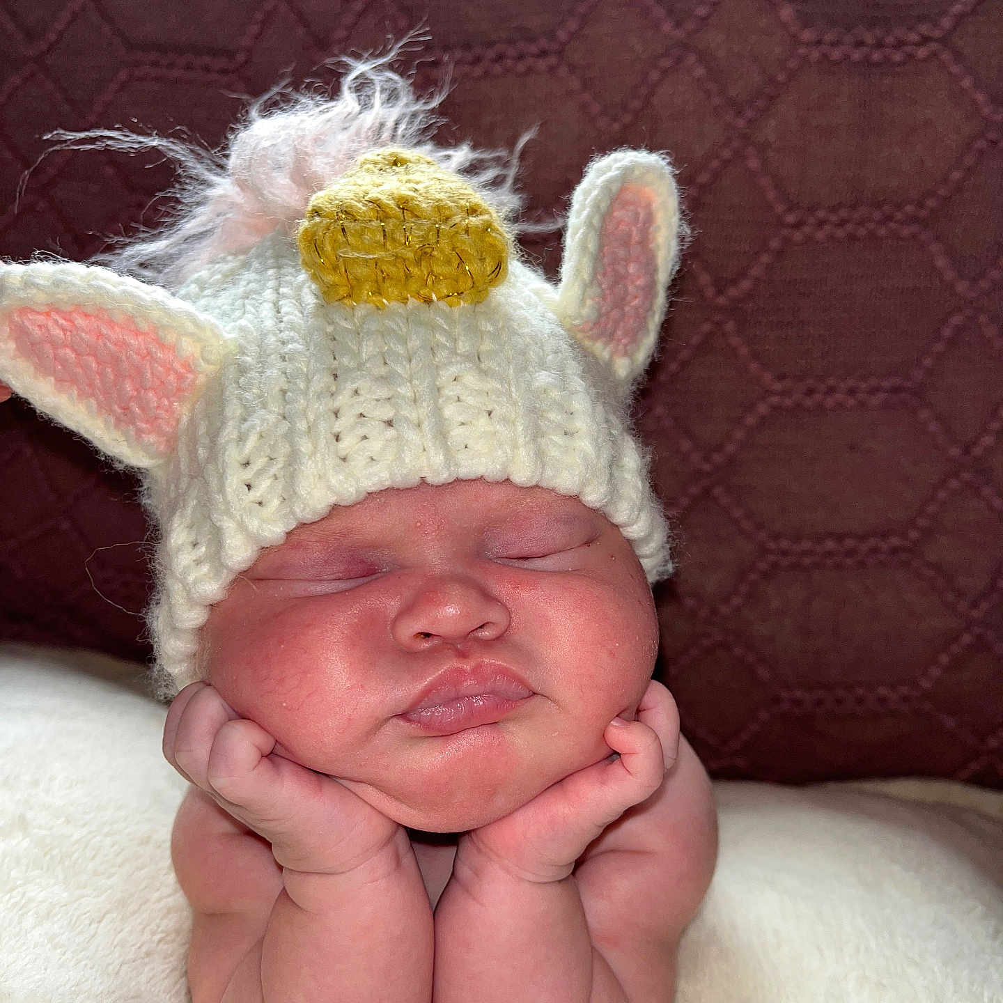 Gianna is registered to the contest to win money with this photo: baby, beanie, bodypart, bonnet, cap, clothing, face, finger, glove, hand, hat, head, newborn, person, photography, portrait, sleeping