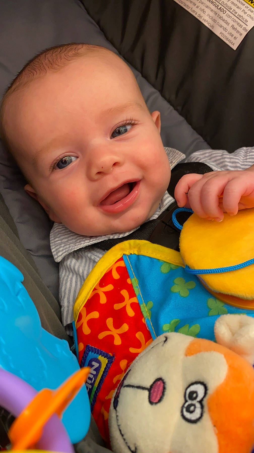 Dallas joined the competition — help win amazing prizes! baby, baby_playing_with_toys, baby_toddler_clothing, cheek, eye, facial_expression, finger, fun, happy, head, mouth, nose, orange, organ, person, photograph, product, skin, smile, textile