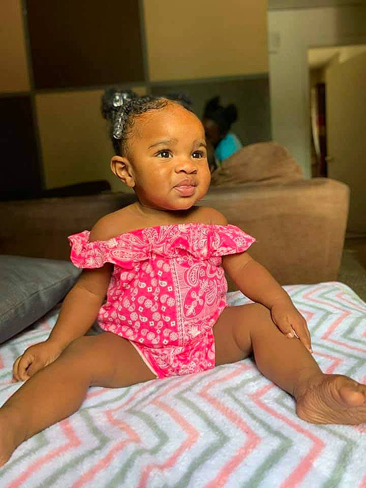 Amia joined the competition — help win amazing prizes! baby, cheek, child, daughter, face, person, pink, sitting, skin, smile, toddler, vacation