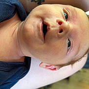 Weston is registered to the contest to win money with this photo: baby, newborn, smiling, face, tattoo, arm, skin, indoor, closeup, child, infant, person, expression, cute, eyes, happy, human, people, portrait, love