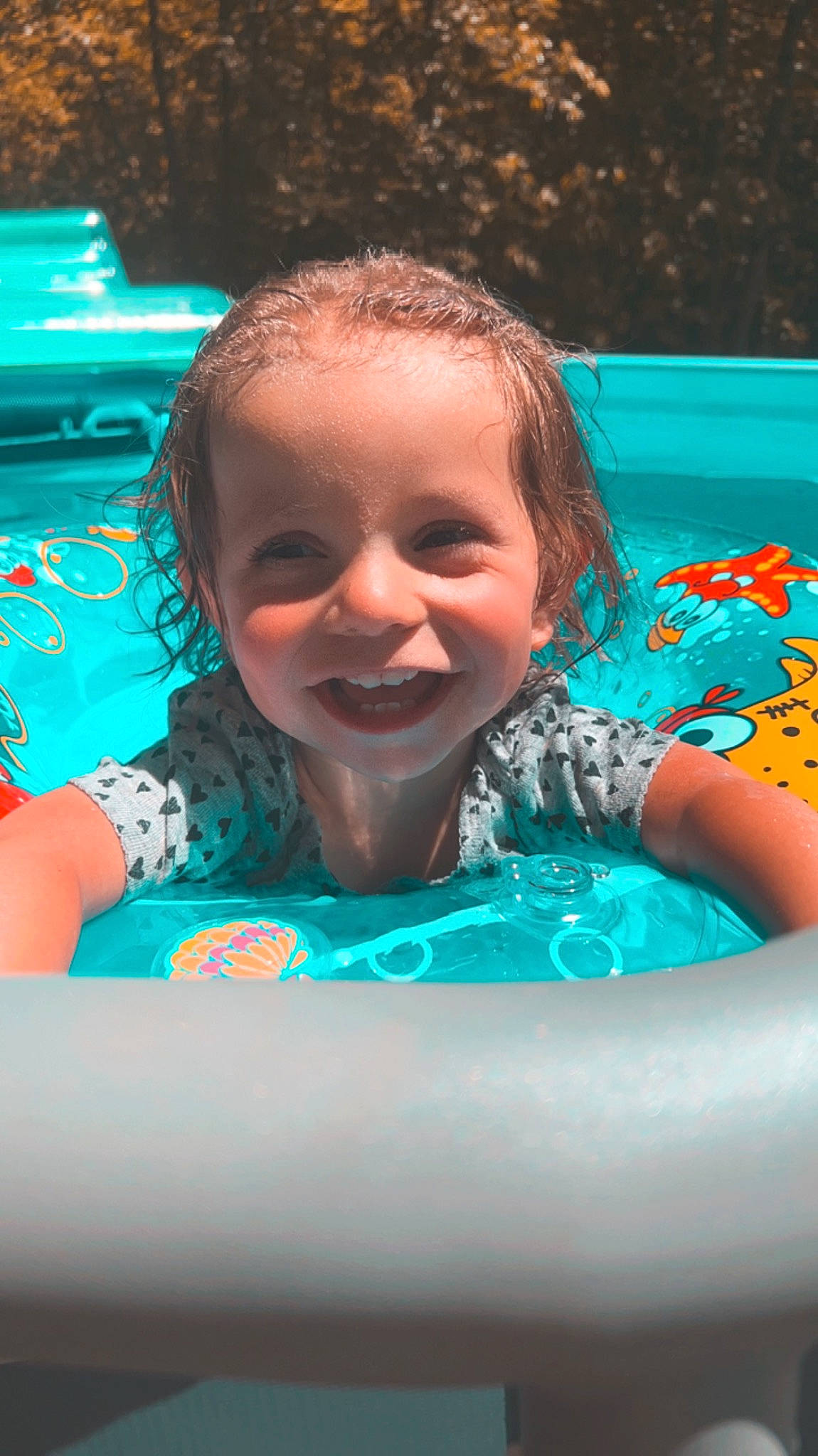 Charleigh joined the competition — help win amazing prizes! aqua, baby, bathing, child, flash_photography, fun, grass, happy, inflatable, joy, laugh, leisure, person, pink, play, recreation, smile, summer, swimming_pool, toddler