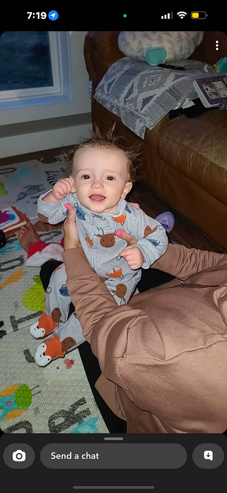 Luxton joined the competition — help win amazing prizes! baby, baby_toddler_clothing, cheek, child, comfort, couch, eye, face, floor, flooring, head, living_room, person, product, room, skin, sleeve, smile, textile, toddler