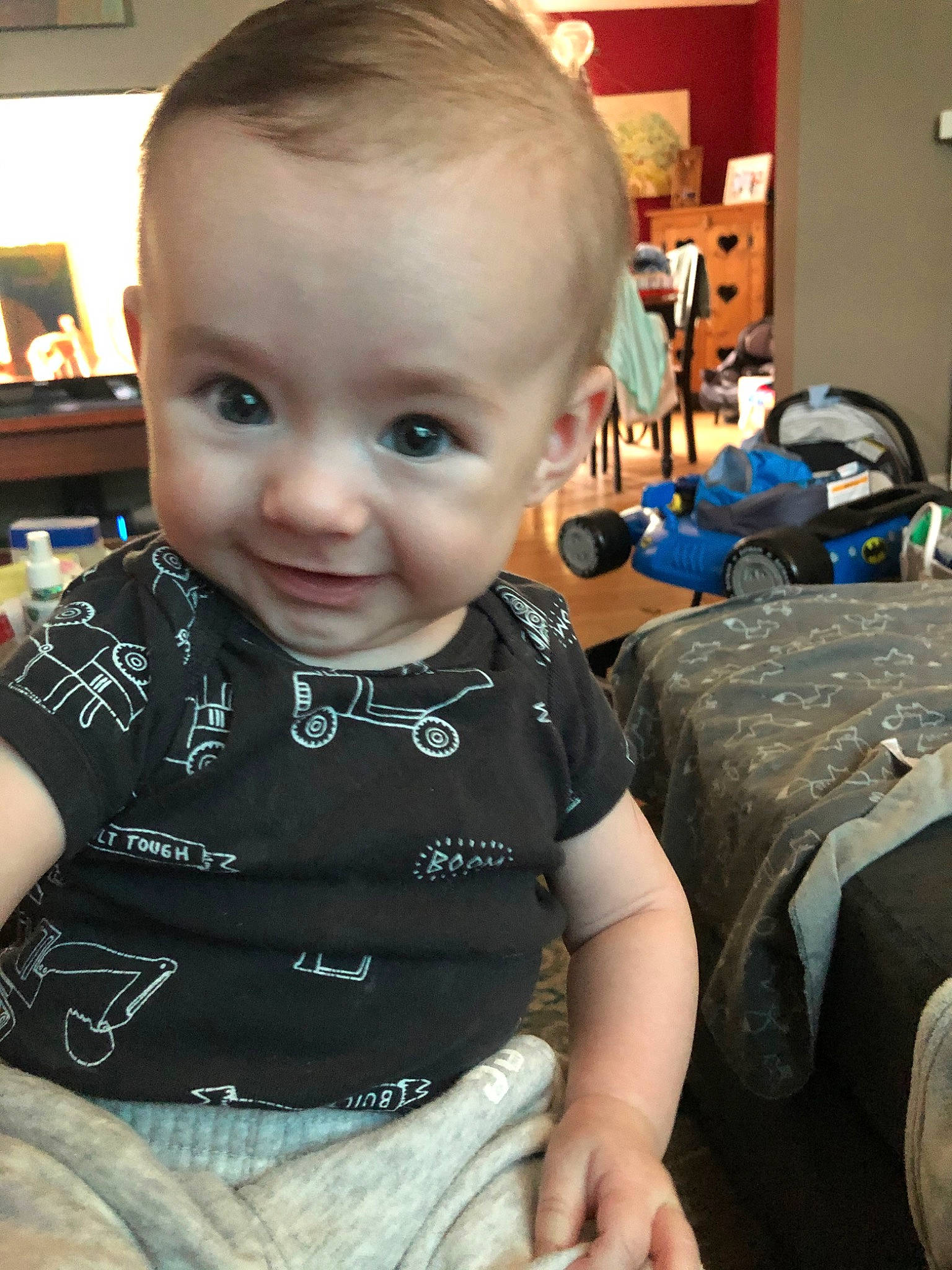Jj is registered to the contest to win money with this photo: baby, cheek, child, cool, ear, electronic_device, eye, face, forehead, head, person, sitting, skin, smile, t_shirt, toddler