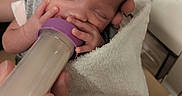 Serenity joined the competition — help win amazing prizes! baby, newborn, bottle, feeding, hand, towel, sleeping, infant, person, closeup, skin, clothing, indoors, care, comfort, peaceful, small, head, delicate, resting