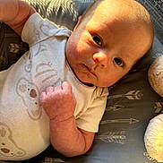 Kyden joined the competition — help win amazing prizes! arrow, baby, child, closeup, cushion, cute, expression, face, hand, indoor, infant, light, newborn, onesie, pattern, plush_toy, shadow, skin, sleeping_area, soft_texture