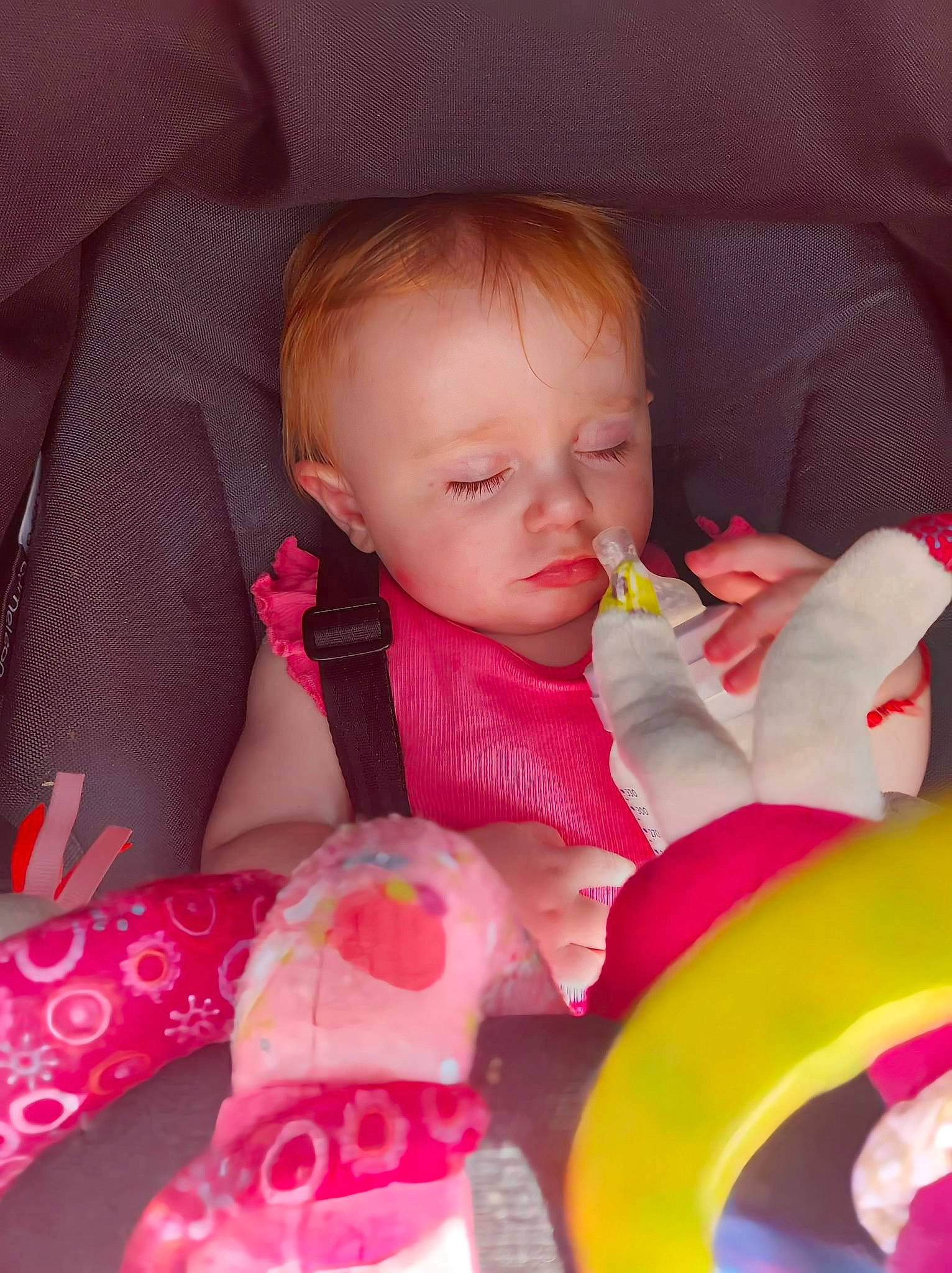 Payton participe au concours pour gagner de l'argent avec cette photo : baby, baby_products, baby_toddler_clothing, carmine, cheek, child, chin, comfort, finger, happy, lap, linens, lip, magenta, nose, person, pink, sitting, skin, textile