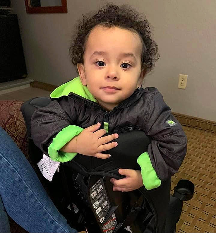 Jovanni joined the competition — help win amazing prizes! baby, baby_carriage, baby_toddler_clothing, cheek, child, comfort, eye, face, gesture, happy, head, human_body, lap, person, picture_frame, sitting, skin, sleeve, television, thumb