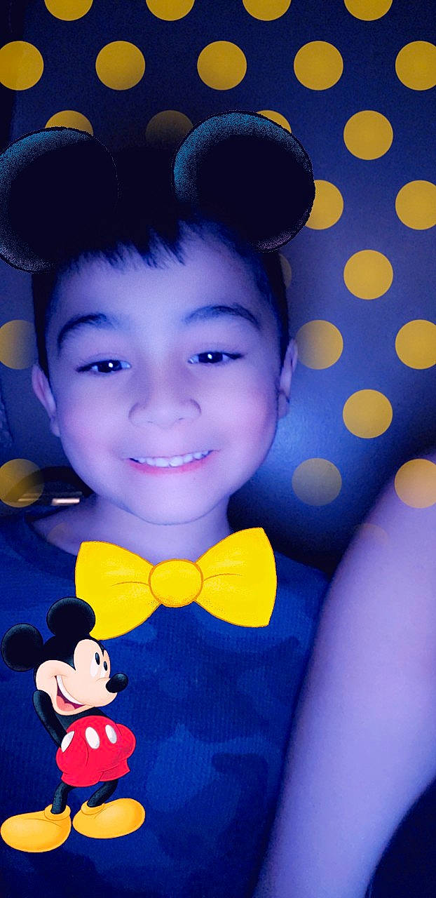 Jason is registered to the contest to win money with this photo: black_hair, child, ear, face, fun, happy, head, joy, person, smile, toddler, yellow