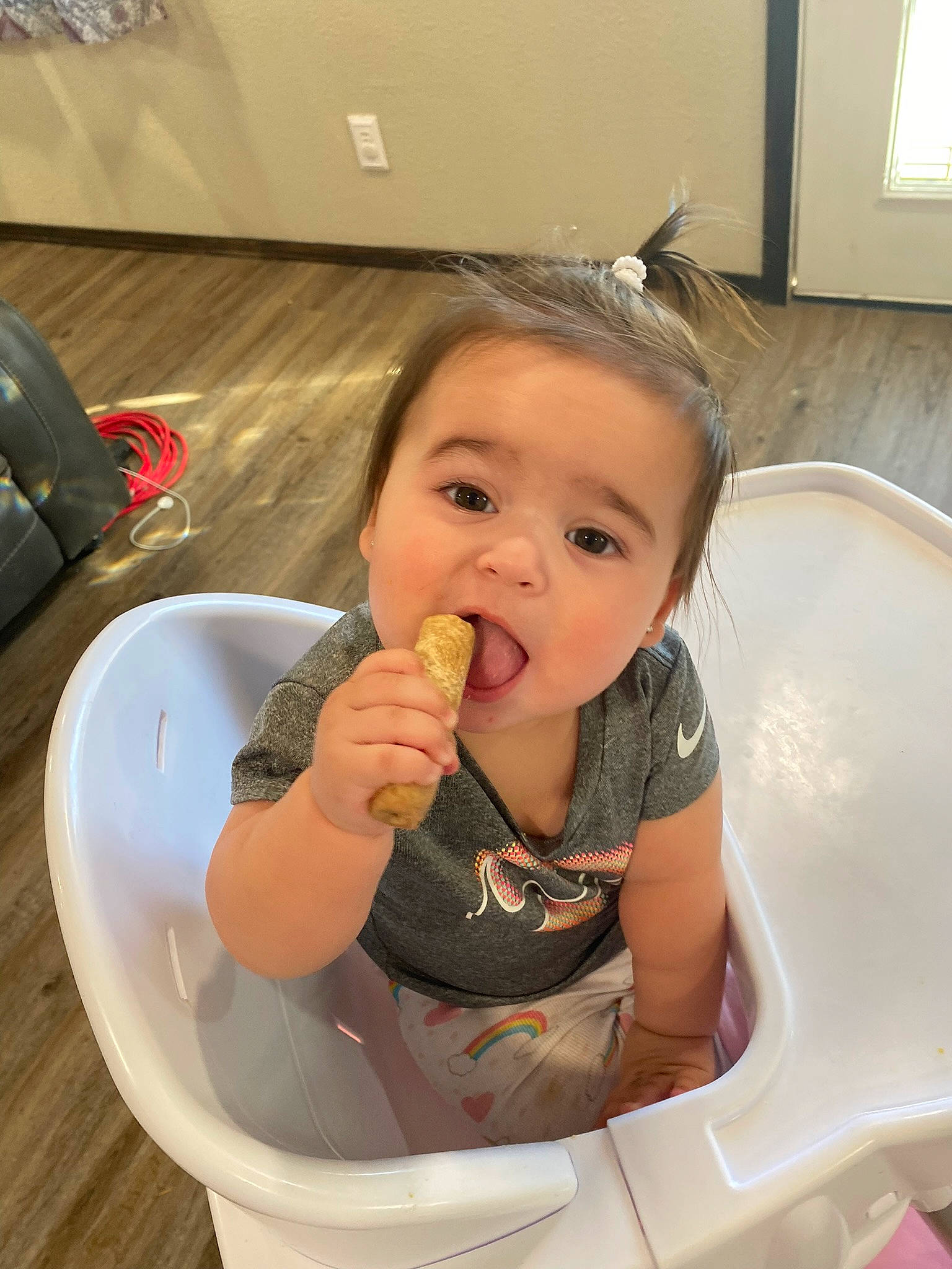 Sianna is registered to the contest to win money with this photo: baby, baby_products, baby_toddler_clothing, bathing, chair, cheek, child, comfort_food, drinkware, eating, food, food_craving, fun, person, play, sitting, skin, table, tableware, thumb