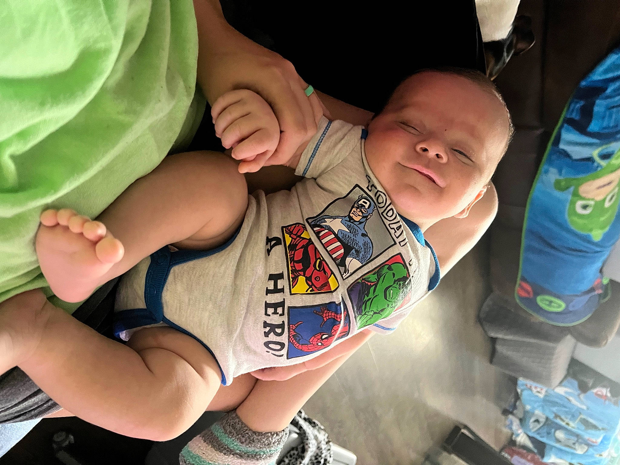 Caden joined the competition — help win amazing prizes! baby, baby_toddler_clothing, child, comfort, elbow, finger, gesture, green, hand, human_body, joint, leg, mouth, nail, neck, person, skin, sleeve, textile, thigh