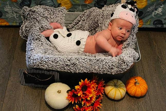 Caden is registered to the contest to win money with this photo: baby, baby_toddler_clothing, basket, calabaza, costume_hat, cucurbita, fashion_accessory, flooring, gourd, grass, headwear, linens, natural_foods, person, pumpkin, sitting, squash, toddler, vegetable, whole_food