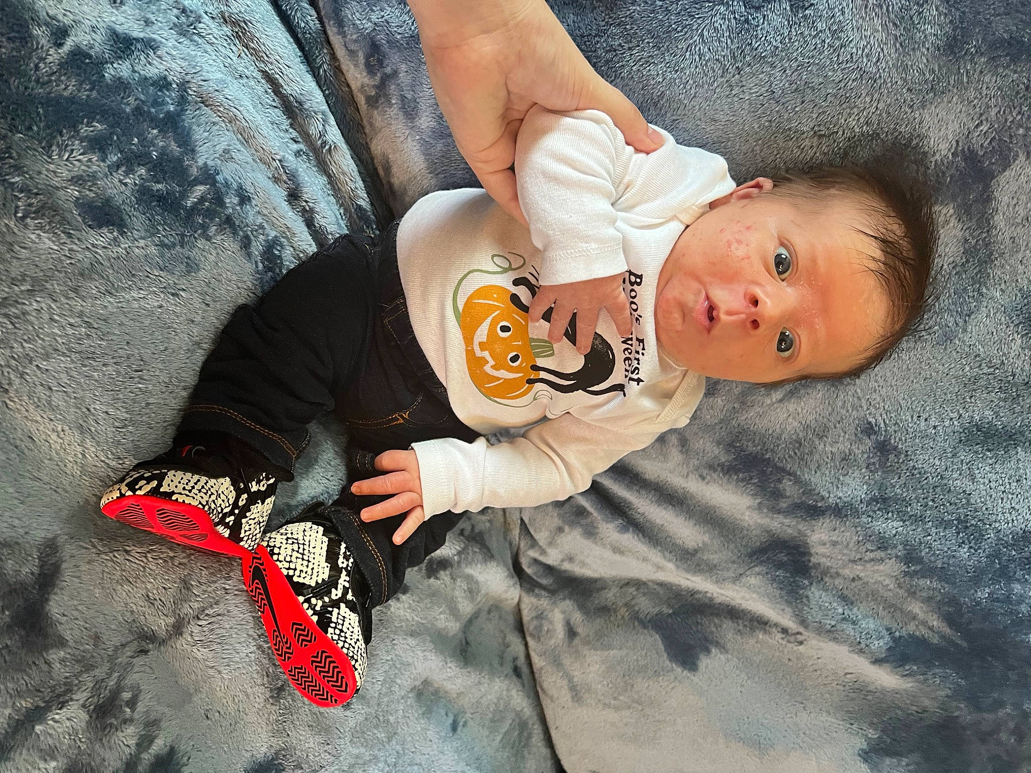 Caden is registered to the contest to win money with this photo: baby, baby_products, baby_toddler_clothing, ball, carmine, child, comfort, finger, flash_photography, flooring, fun, happy, linens, person, sitting, sleeve, toddler, wood
