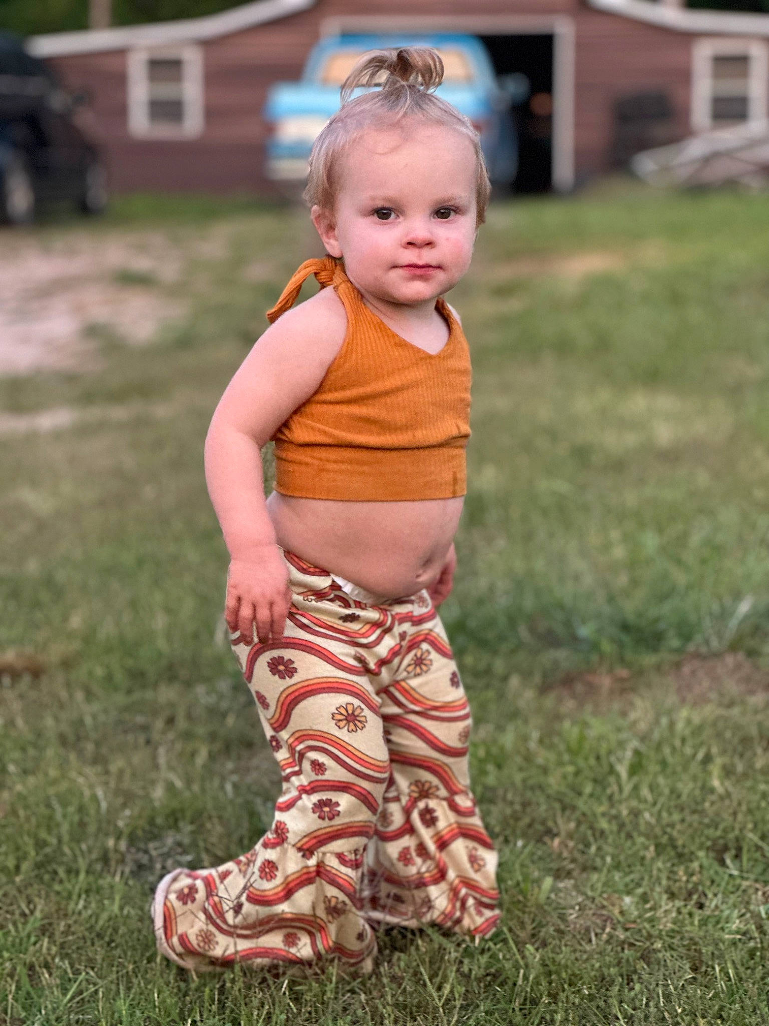 Emory joined the competition — help win amazing prizes! baby, baby_toddler_clothing, child, eye, face, fun, grass, grass_family, happy, head, human_leg, lawn, leg, pattern, people_in_nature, person, plant, sitting, sleeve, toddler