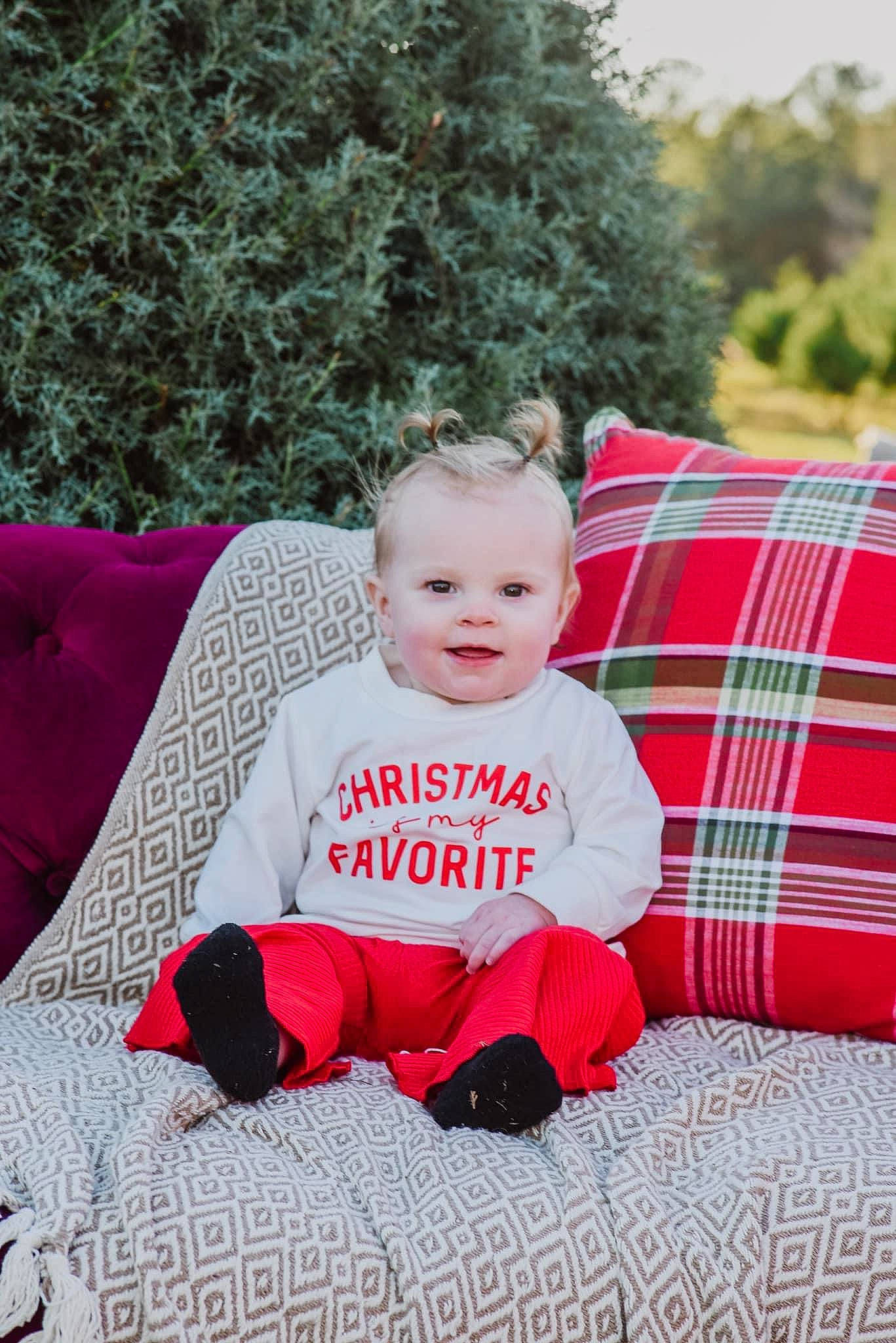Emory joined the competition — help win amazing prizes! baby, baby_toddler_clothing, child, comfort, event, grass, happy, holiday, joy, magenta, pattern, person, plaid, plant, red, sitting, sleeve, smile, t_shirt, tartan