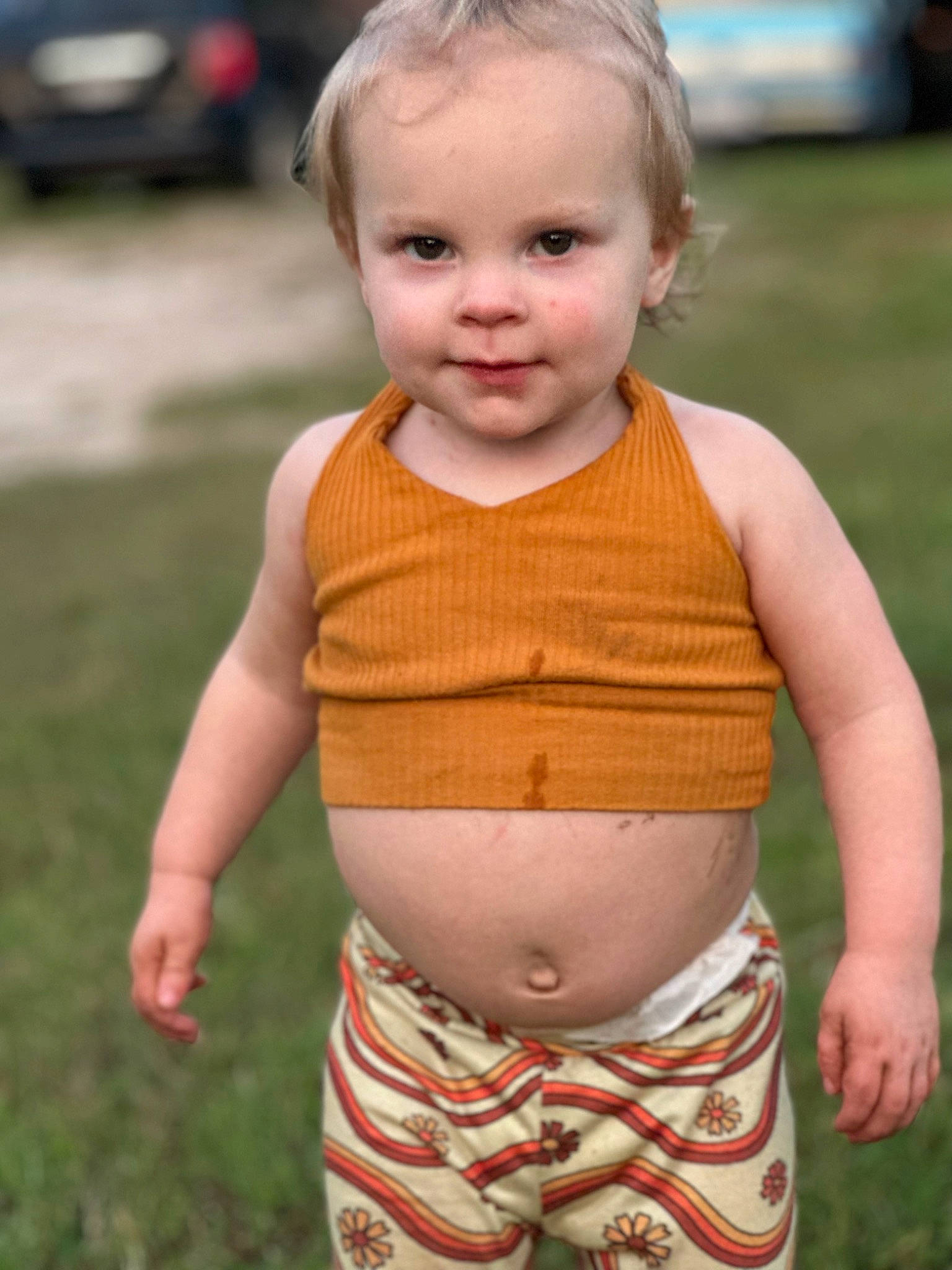 Emory joined the competition — help win amazing prizes! abdomen, baby, baby_toddler_clothing, cheek, chest, face, grass, hairstyle, hand, happy, head, human_body, neck, person, skin, sleeve, standing, stomach, toddler, trunk