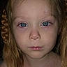 blonde_hair, blue_eyes, braid, child, close_up, dark_background, eyes, face, front_facing, head, indoors, long_hair, mouth, nose, person, photograph, portrait, serious, shoulders, skin