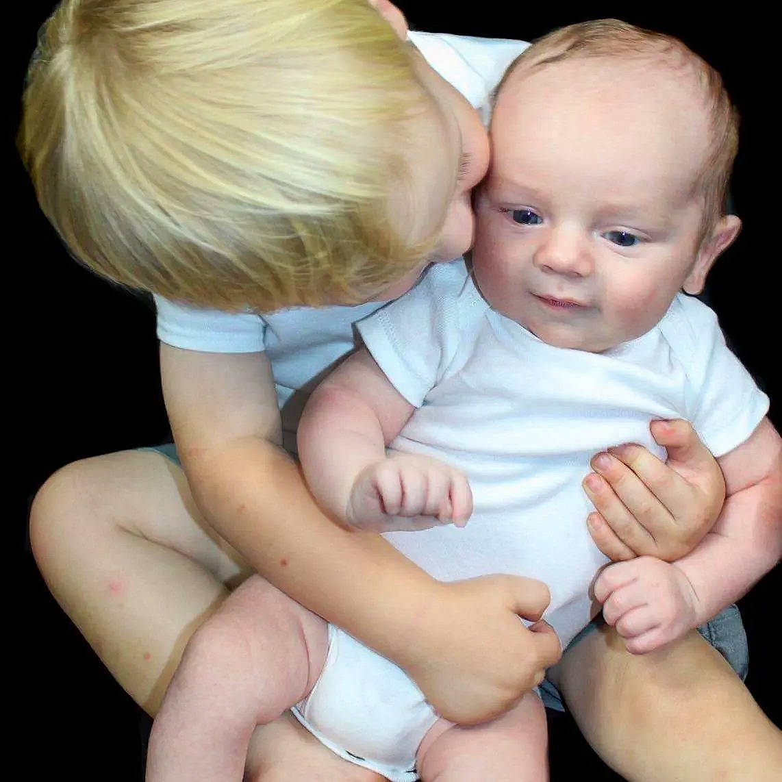 Emmett is registered to the contest to win money with this photo: arm, baby, baby_toddler_clothing, cheek, comfort, eye, finger, gesture, hand, happy, human_body, muscle, neck, person, photograph, skin, stomach, thigh, toddler, trunk