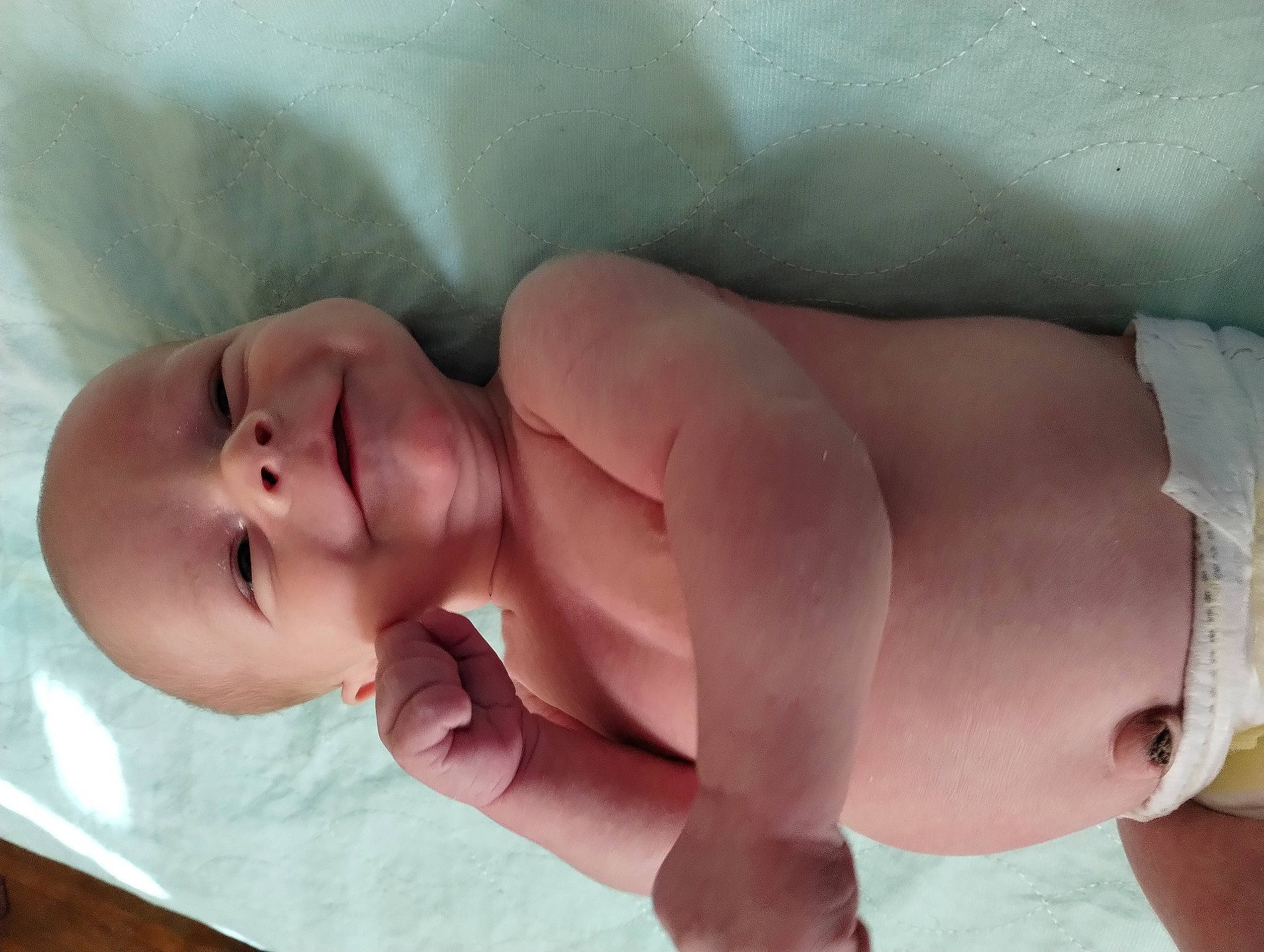 Dakotah is registered to the contest to win money with this photo: arm, baby, cheek, child, comfort, eye, finger, foot, gesture, human_body, human_leg, leg, linens, lip, mouth, neck, nose, person, skin, thumb