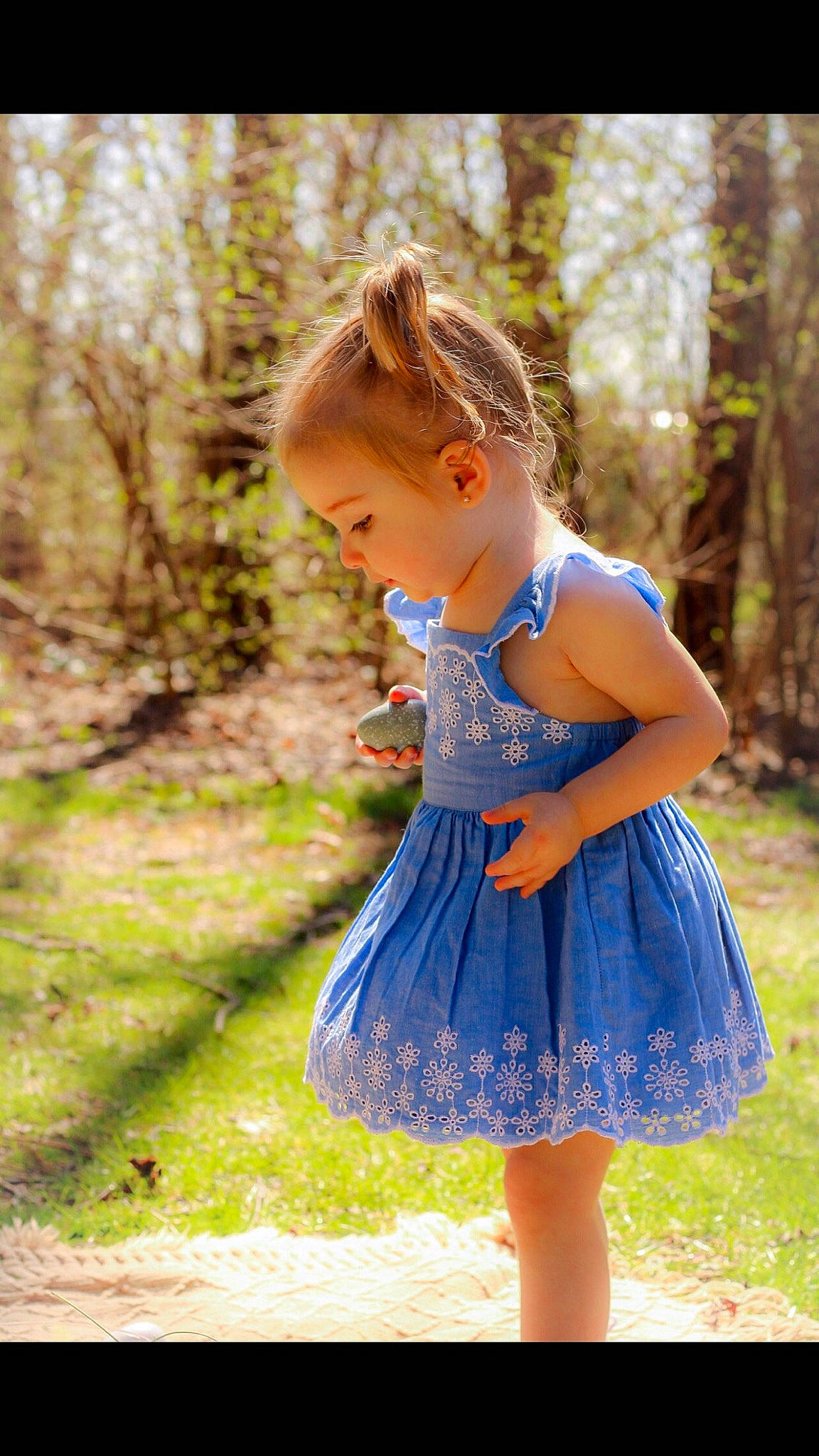 Hazel is registered to the contest to win money with this photo: baby_toddler_clothing, child, day_dress, dress, electric_blue, forest, grass, hairstyle, happy, long_hair, pattern, people_in_nature, person, plant, shoulder, sleeve, street_fashion, toddler, tree, waist