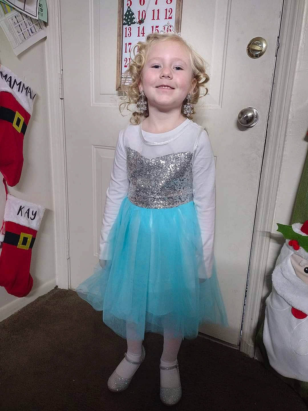 Jasmine is registered to the contest to win money with this photo: baby_toddler_clothing, child, costume, day_dress, electric_blue, event, fashion_design, formal_wear, happy, joy, magenta, pattern, peach, person, pink, room, sleeve, smile, sock, toddler