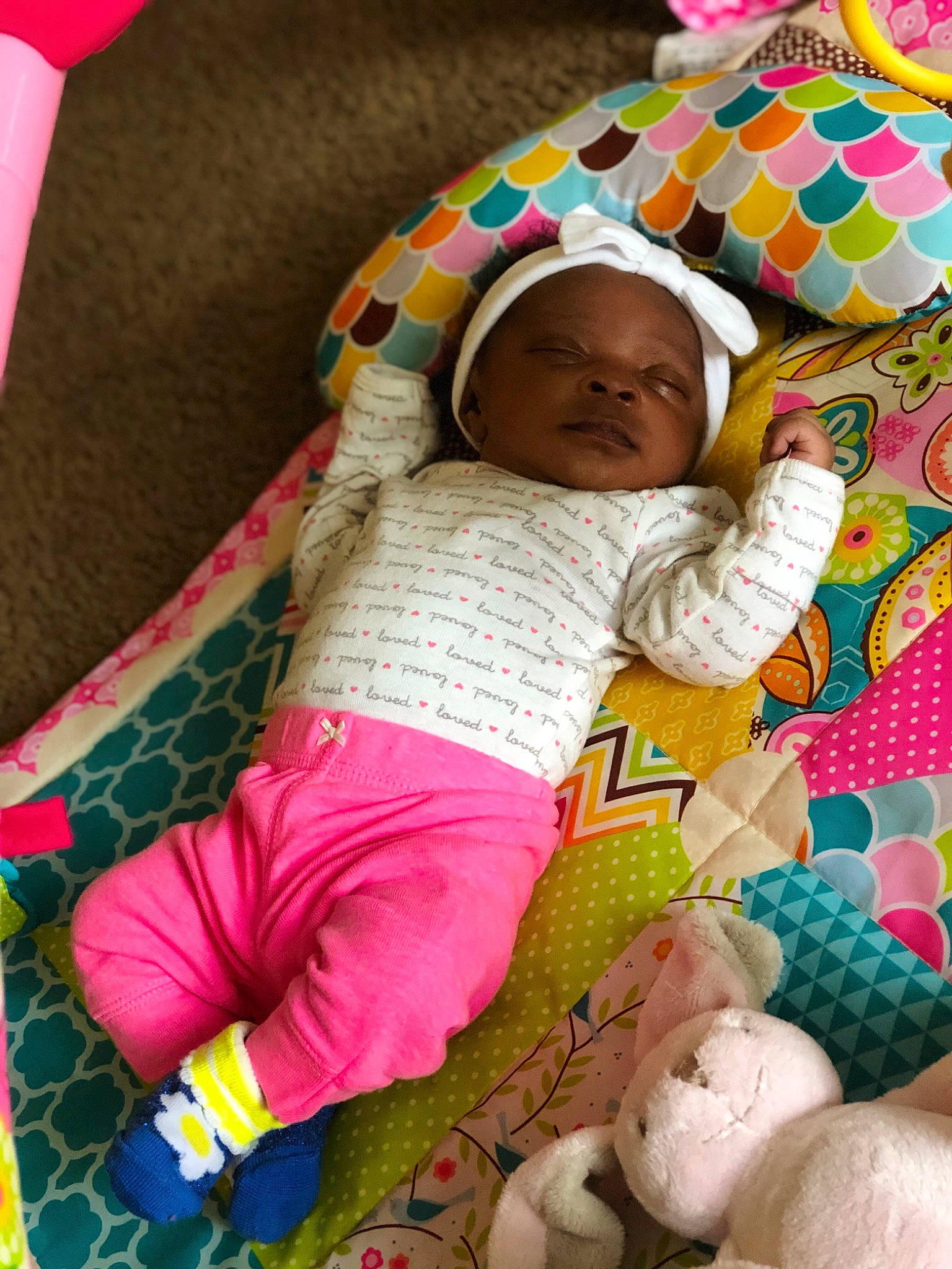 Kyziah is registered to the contest to win money with this photo: baby, baby_toddler_clothing, baby_toys, blanket, child, linens, nap_mat, pattern, person, pink, play, sleep, textile, toddler