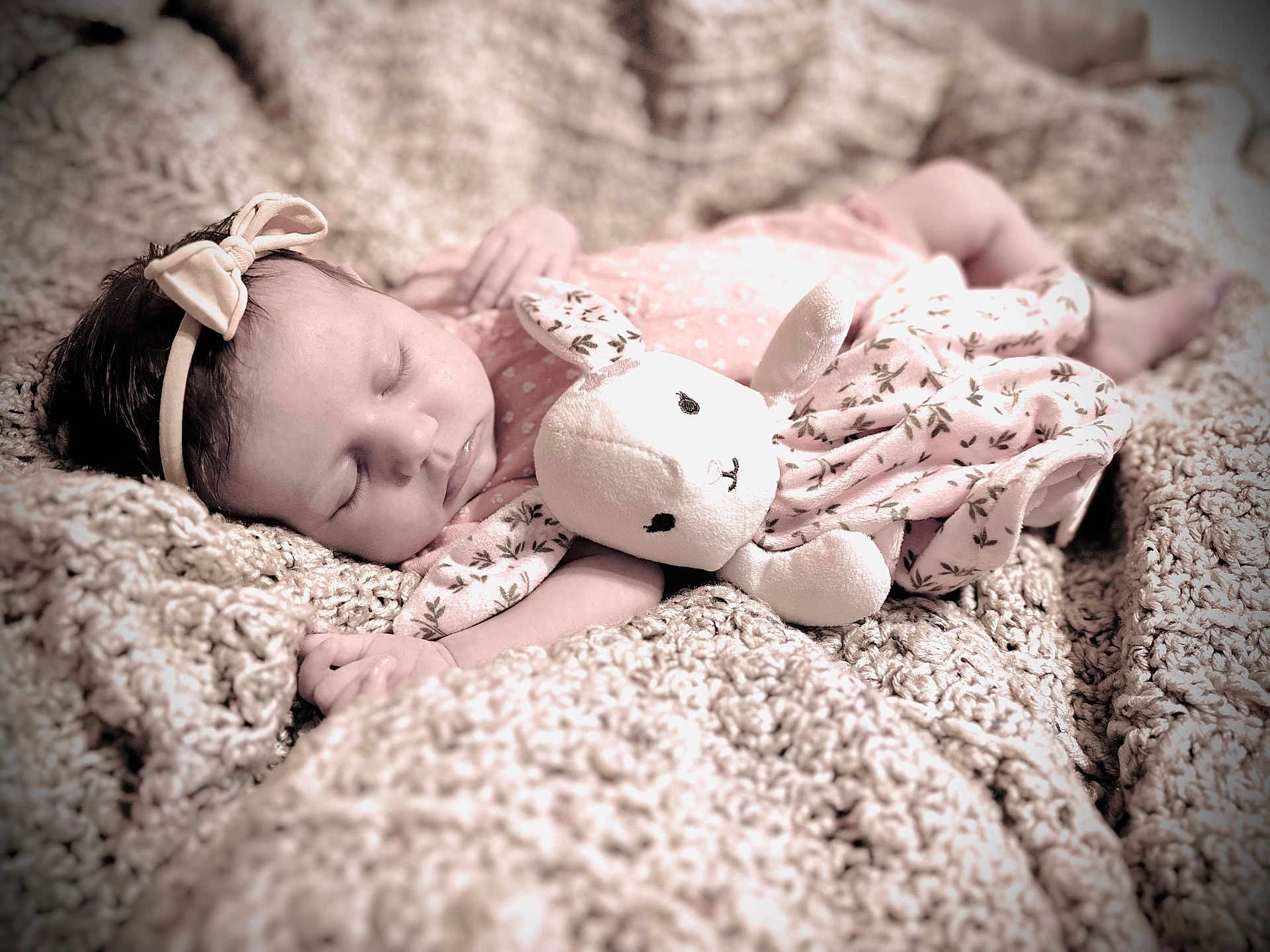 Vera is registered to the contest to win money with this photo: baby, sleeping, headband, bow, plush_toy, bunny, blanket, knit, soft_toy, infant, cute, cozy, pink, floral, fabric, child, peaceful, portrait, indoors, resting