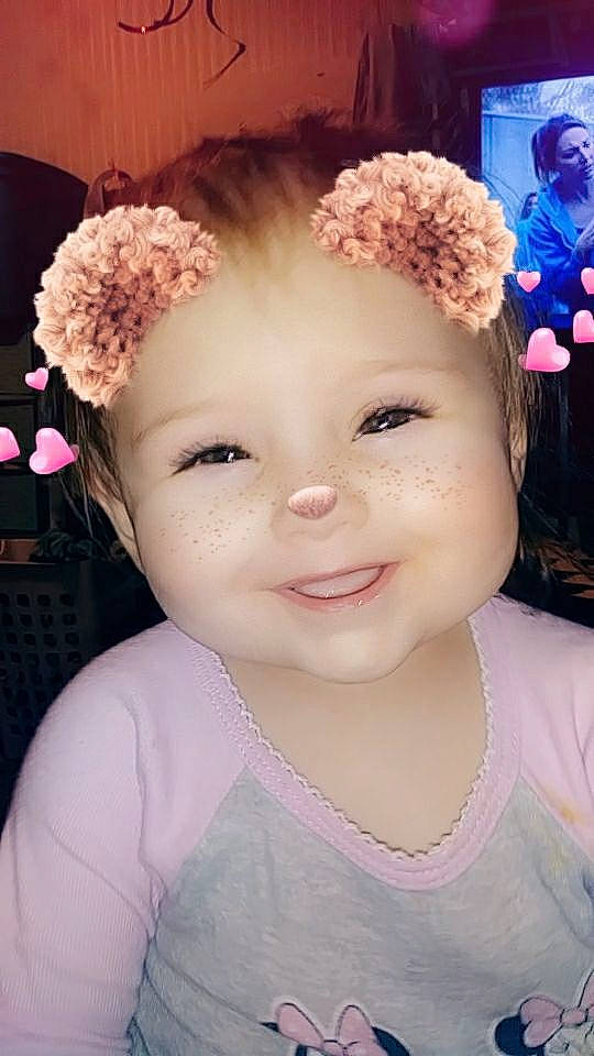 Gabby is registered to the contest to win money with this photo: beauty, brown_hair, cheek, child, child_model, cornales, face, fashion_accessory, flower, hair, hair_accessory, hairstyle, head, headgear, joy, nose, person, pink, plant, skin