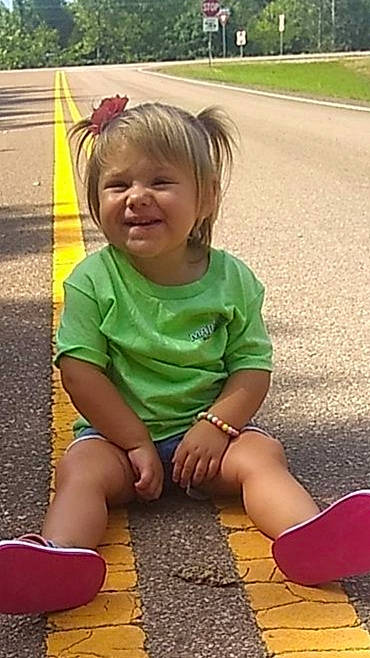 Gabby joined the competition — help win amazing prizes! blond, child, facial_expression, footwear, fun, grass, hair, human_leg, joint, joy, knee, leg, person, play, playground, public_space, shorts, sitting, smile, summer