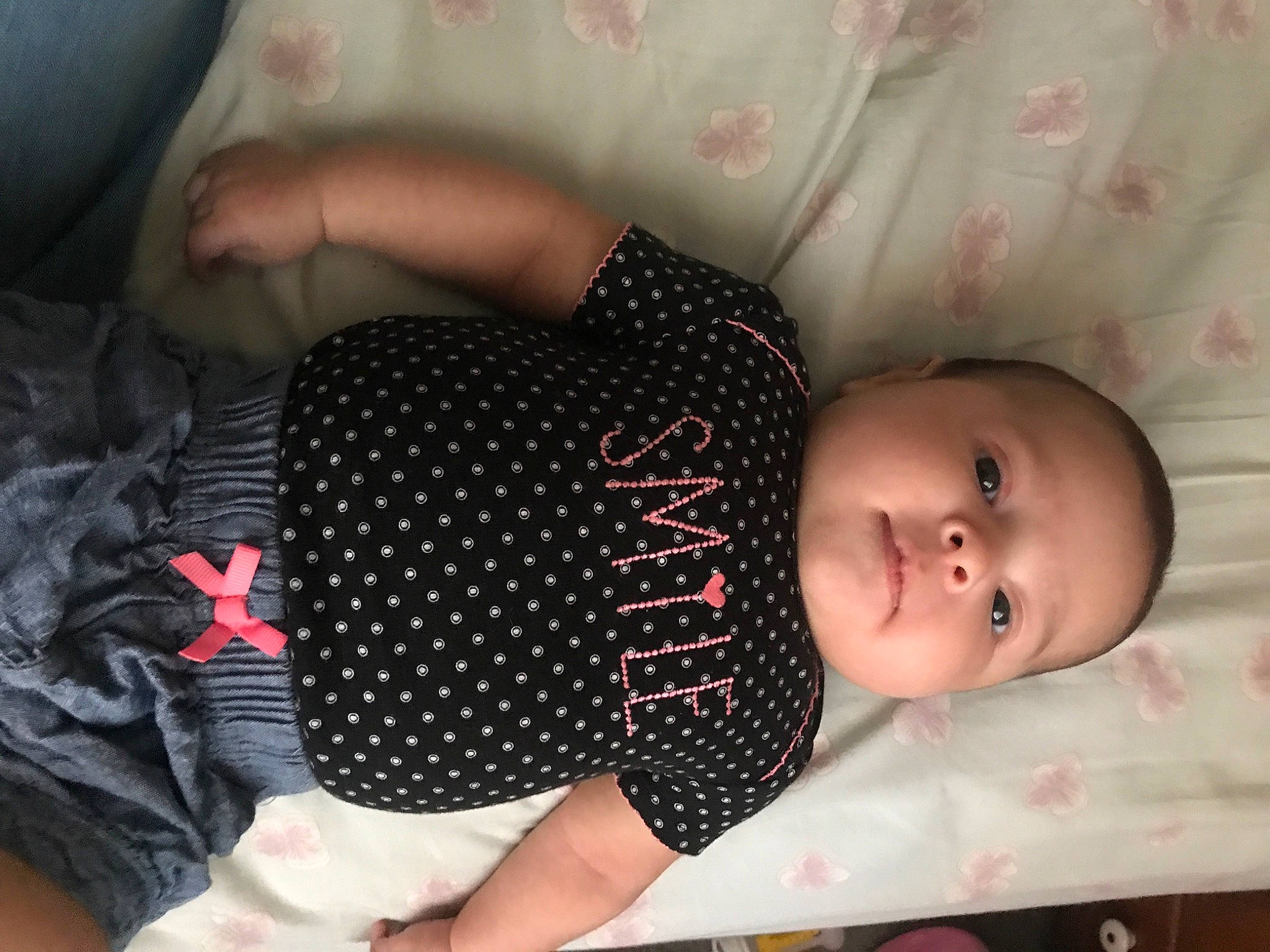 Isabelle is registered to the contest to win money with this photo: baby, baby_products, baby_toddler_clothing, black_hair, cheek, child, design, finger, nap, pattern, person, product, skin, sleep, toddler