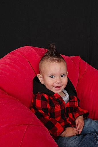 Sebastian joined the competition — help win amazing prizes! arm, baby, baby_toddler_clothing, carmine, child, comfort, couch, flash_photography, fun, happy, joy, outerwear, pattern, person, plaid, sitting, sleeve, smile, t_shirt, tartan