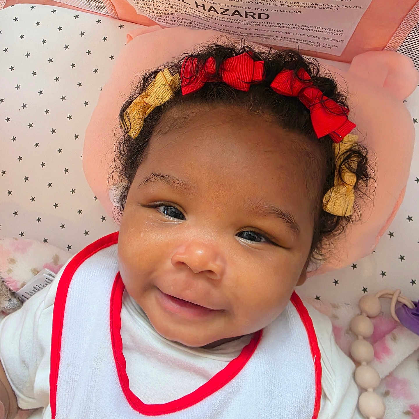 Akira joined the competition — help win amazing prizes! baby, child, smiling, headband, bows, bib, white_clothing, soft_bedding, star_pattern, toy, beads, closeup, indoor, cute, infant, face, happy, portrait, curly_hair, skin
