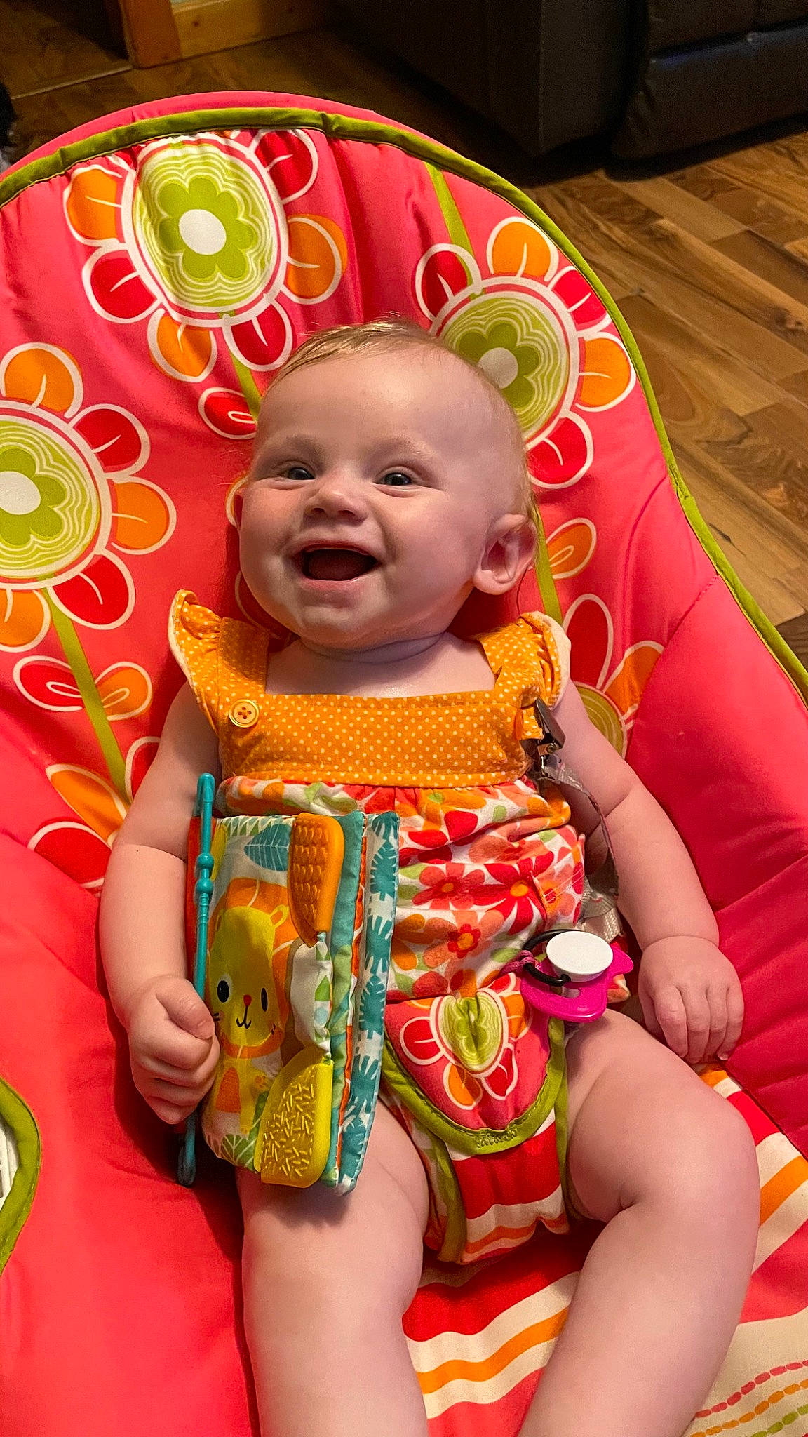 Adalynn is registered to the contest to win money with this photo: baby_toddler_clothing, cheek, dress, eye, face, facial_expression, fun, happy, head, human_body, iris, leaf, mouth, orange, person, pink, product, skin, smile, toddler