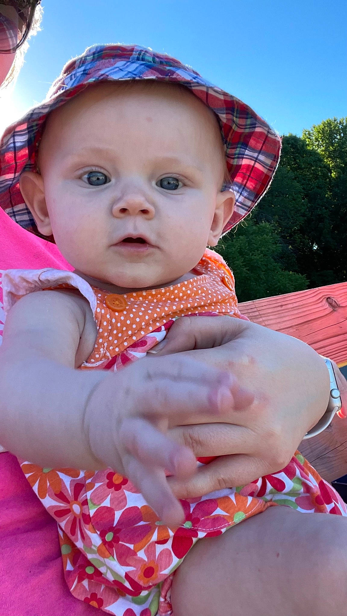 Adalynn is registered to the contest to win money with this photo: baby, baby_toddler_clothing, blue, cap, child, finger, fun, grass, hand, happy, hat, headwear, lip, magenta, pattern, person, pink, red, skin, sky
