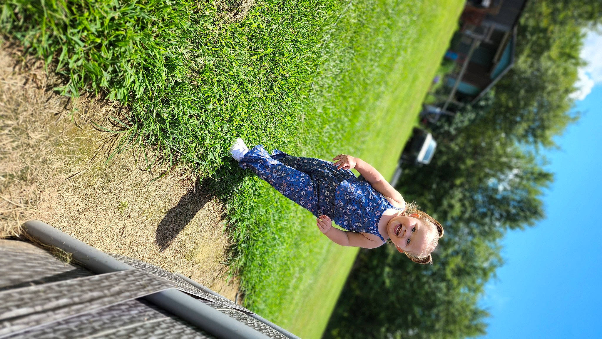 Paisley-grace is registered to the contest to win money with this photo: adventure, asphalt, denim, electric_blue, fun, garden, grass, joy, landscape, lawn, leisure, people_in_nature, person, plant, recreation, shadow, shrub, sky, slope, soil