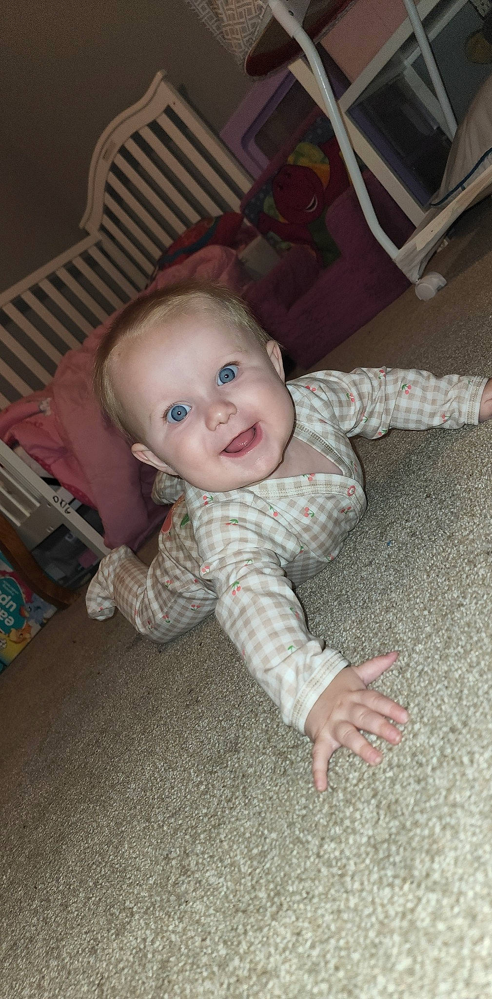 Madilyn joined the competition — help win amazing prizes! baby, baby_toddler_clothing, cheek, child, comfort, crawling, eye, floor, flooring, fun, hardwood, human_body, iris, nose, person, sitting, skin, sleeve, smile, toddler