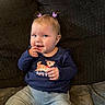 toddler, child, baby, sitting, couch, indoor, clothing, pants, long_sleeve_shirt, hair_clips, blue_clothing, cute, smiling, face, person, young_child, portrait, home, casual, seated