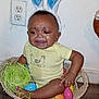 baby, bunny_ears, basket, crying, plastic_eggs, green_shredded_paper, wooden_floor, yellow_onesie, indoor, child, face, expression, tear, hands, feet, easter_theme, toy, person, sad, headwear